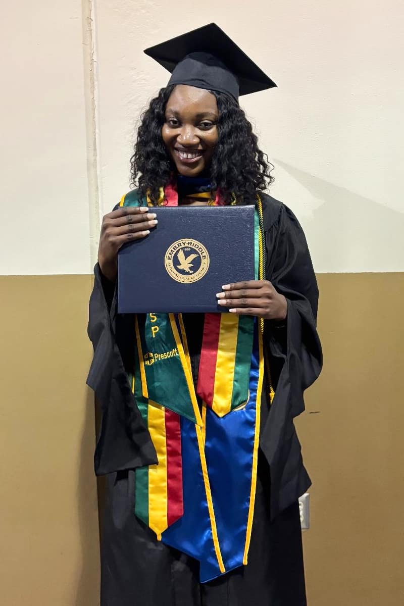 Elizabeth Okine holds diploma.