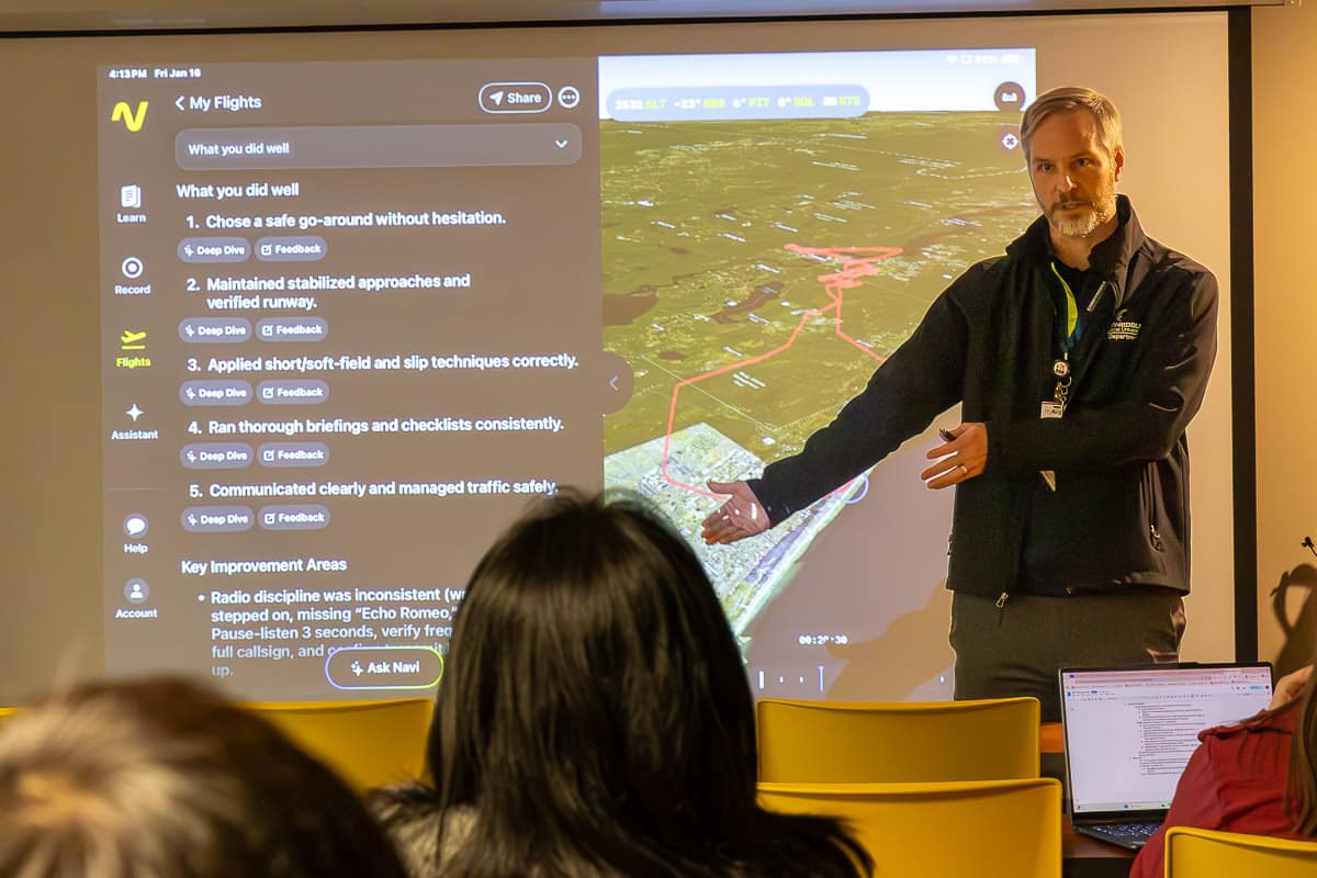 An Embry-Riddle professor demonstrates software with students.