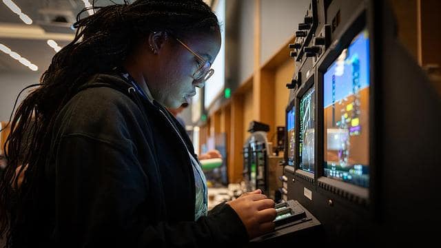Embry-Riddle student works at a computer during a cyber comptetion