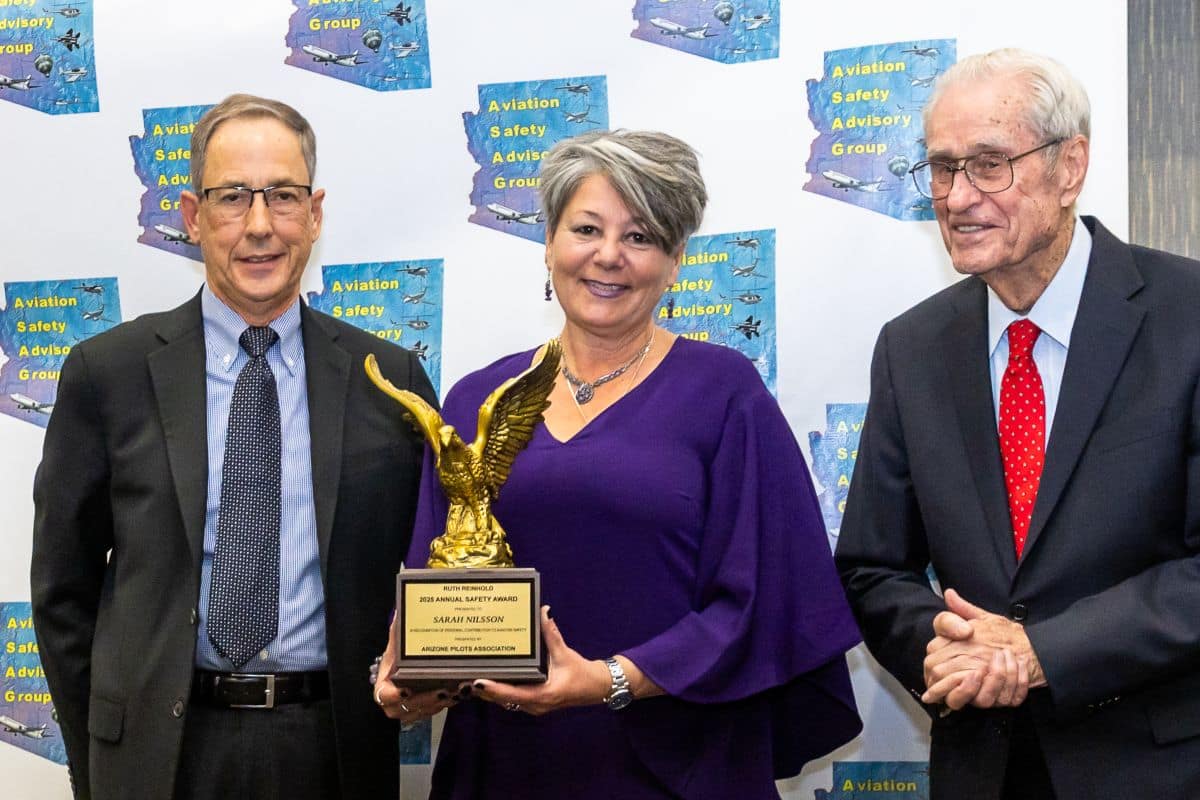 Embry-Riddle professor displays award for significant contributions to aviatoin safety.