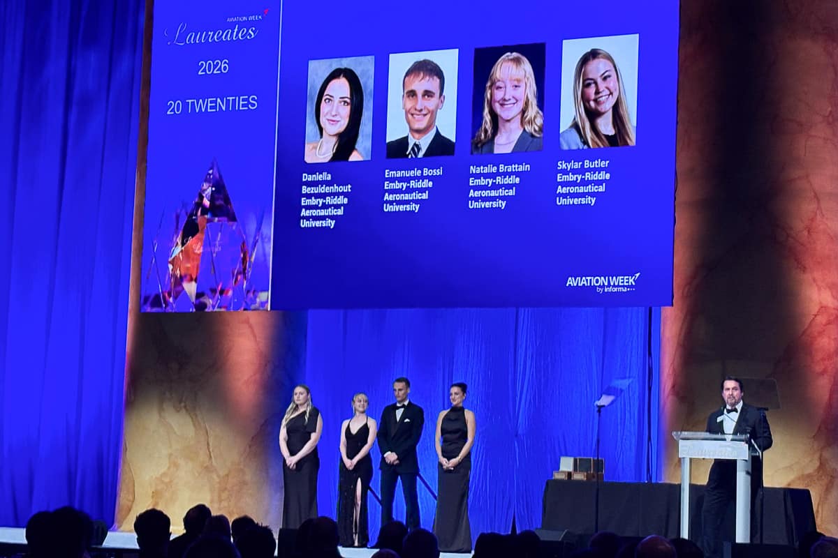Four Embry-Riddle students stand on stage at Aviation Week Network’s 68th Annual Laureate Awards.