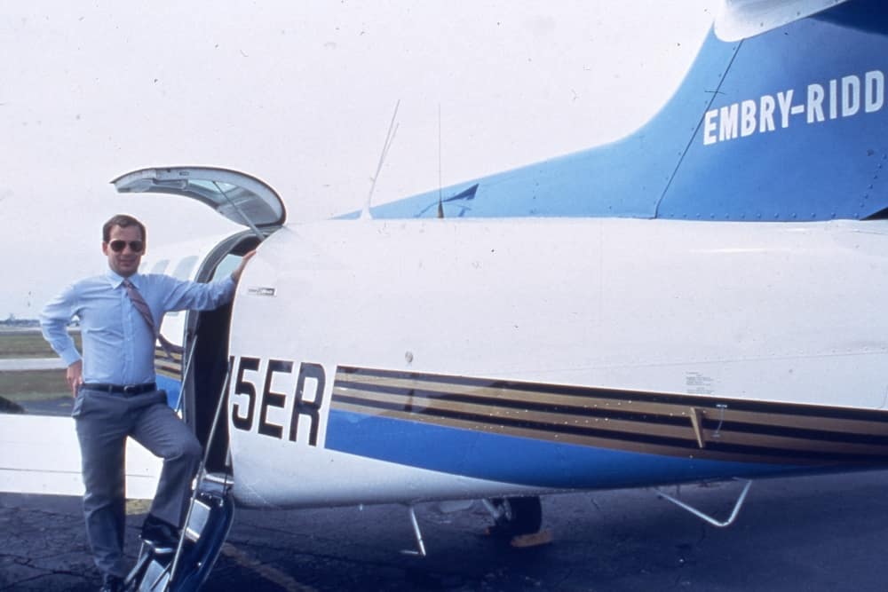 Former Embry-Riddle President Steve Sliwa in front of plane.