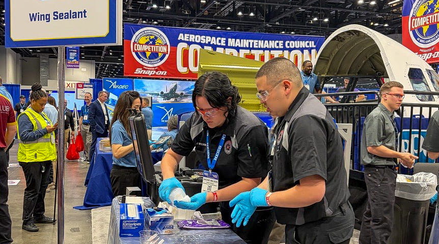 Two Embry-Riddle students compete in the aviation maintenance competition.