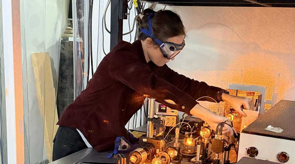 Woman works ona  laser.