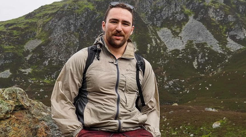 Man in front of mountain in Scotland
