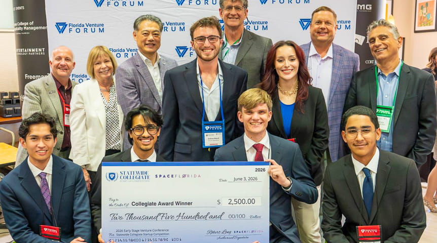 Group holds giant check 