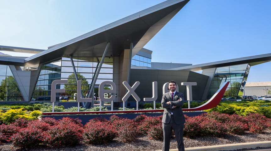 Man in front of Flexjet's headquarters