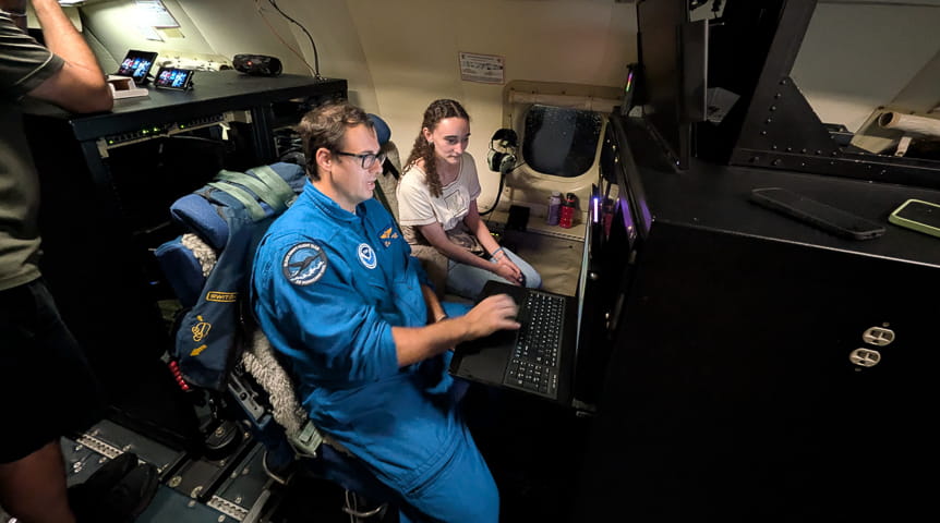 Dr. Josh Wadler and his student Lauren Baez aboard a hurricane hunter aircraft 