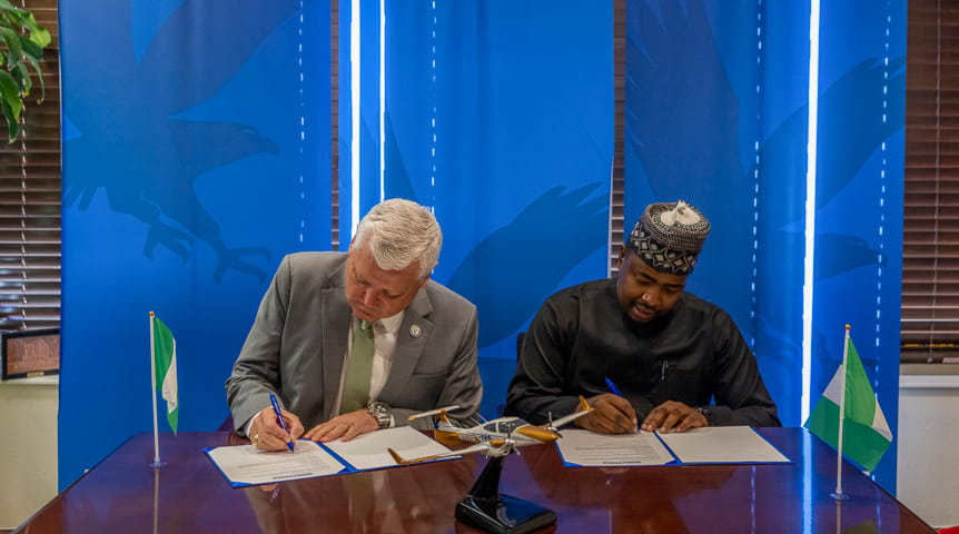 From left, Dr. John Watret, chancellor of Embry-Riddle Worldwide, and Acting AAAU Vice Chancellor Dr. Mustapha Sheik Abdullahi, FInsTA, FCMI. 
