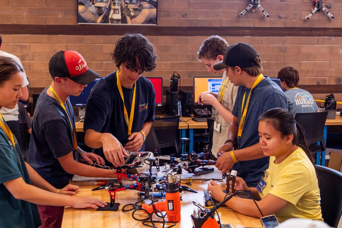High school students collaborate while assembling a quadcopter drone during a hands-on summer camp at Embry-Riddle Aeronautical University’s Prescott Campus. 