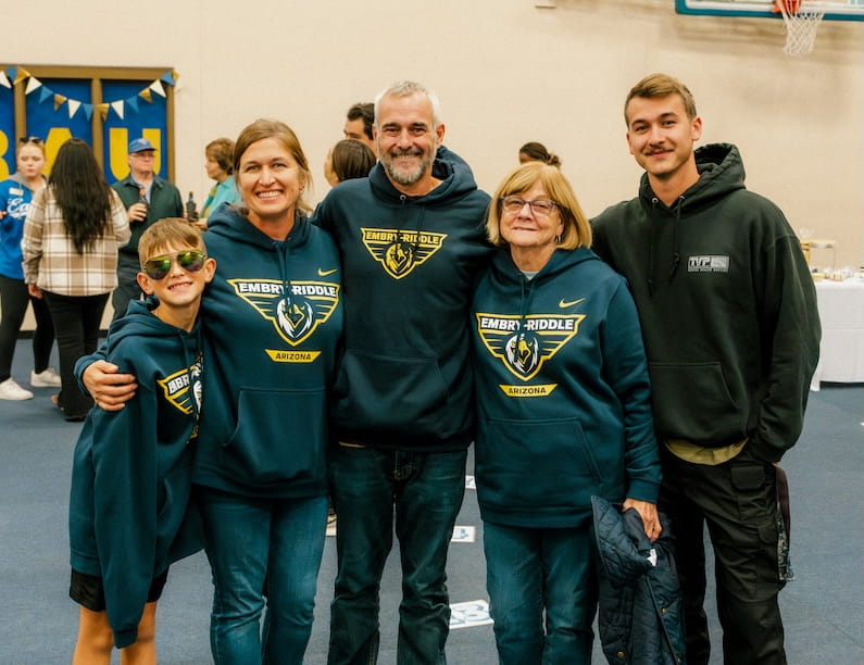 A family wearing Embry-Riddle sweatshirts
