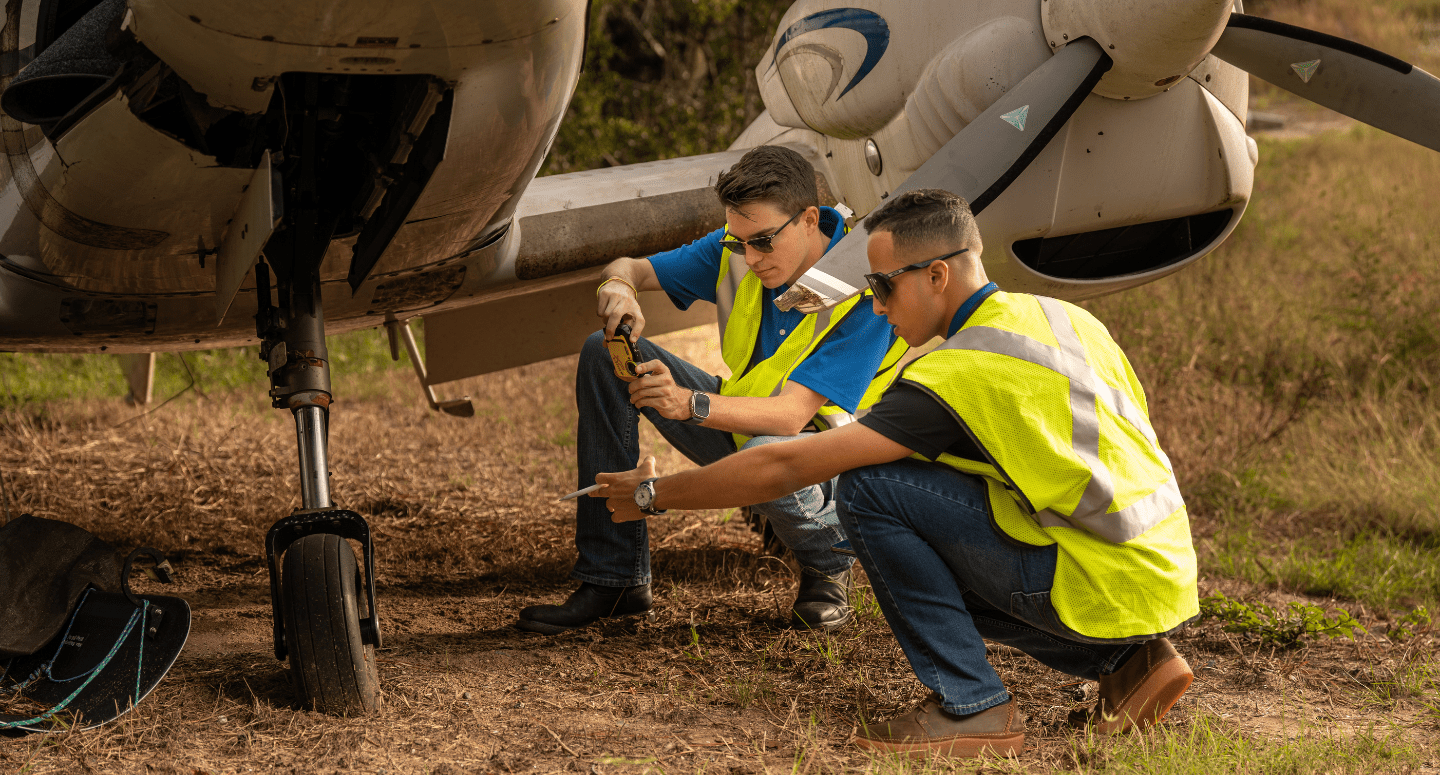Professionals analyze the safety of an aircraft.