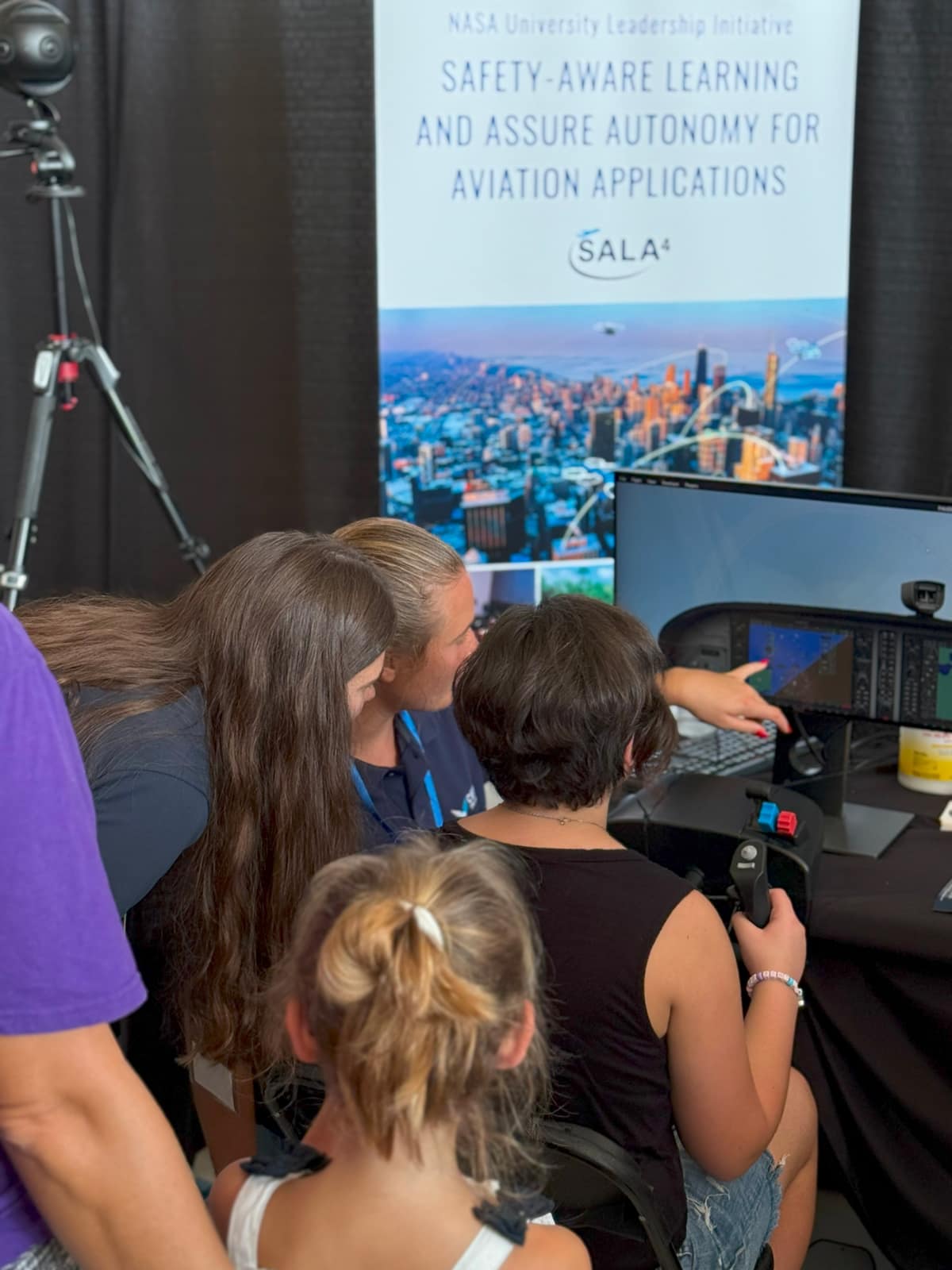 Young students participate in simulator demonstration