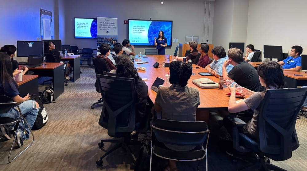 Students gather in a conference room