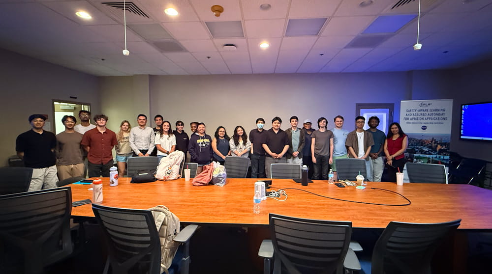 Students pose for a picture in a conference