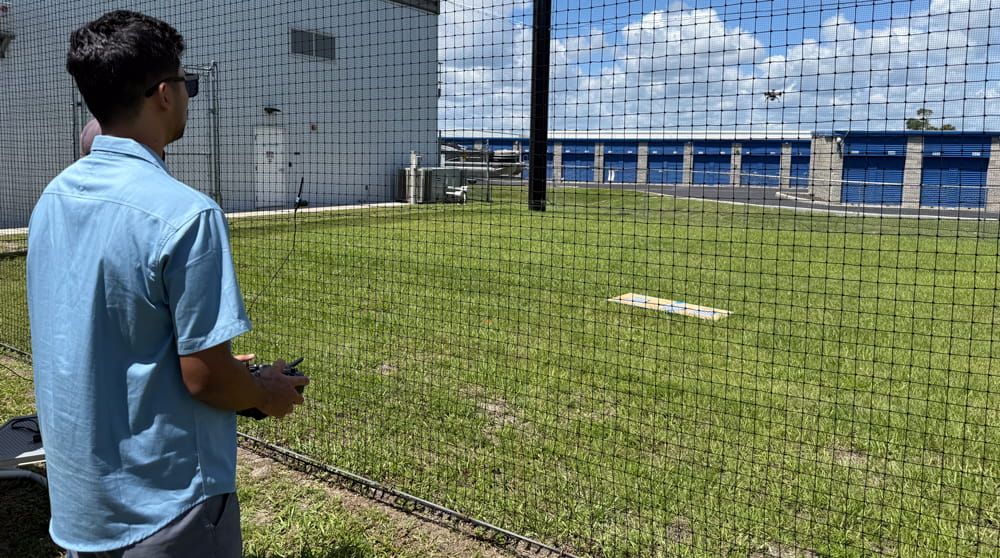 Student uses a drone in the drone net
