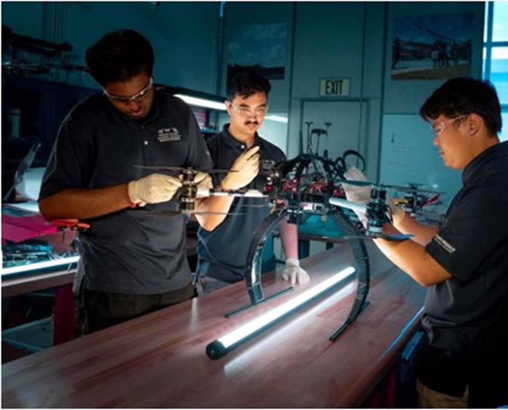 Students work on an autonomous vehicle.