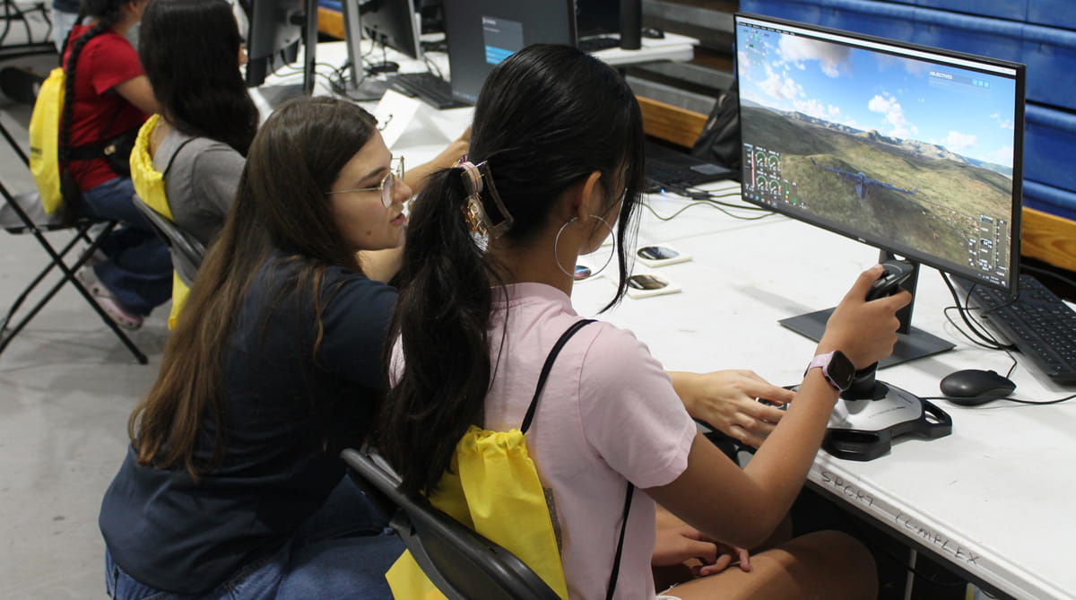 Students work on a simulator