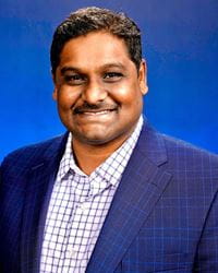 Kranthi Kumar Deveerasetty professional portrait with a blue background