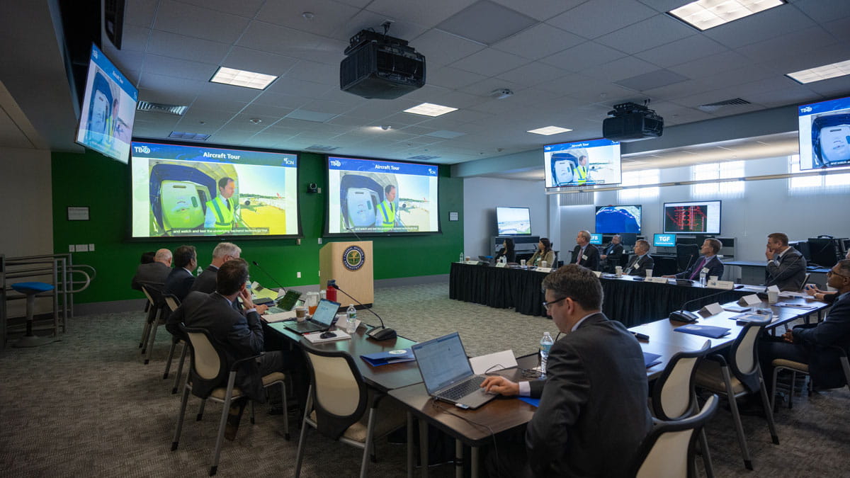 People gather at the Florida Test Bed for a meeting.