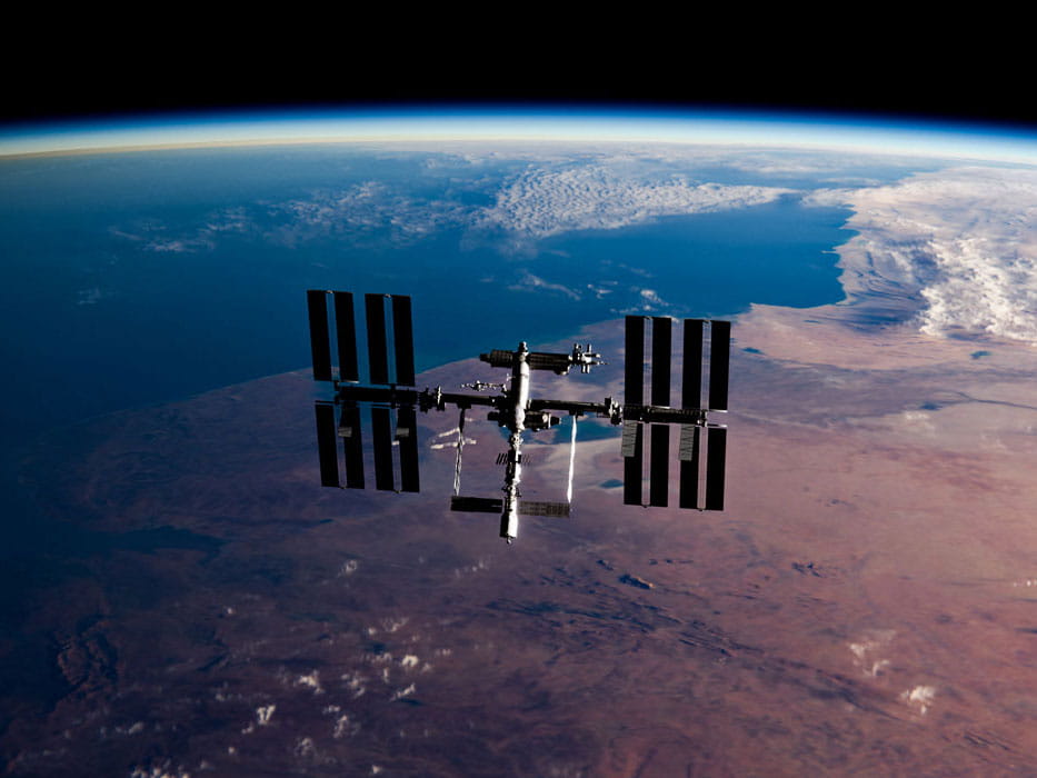 Satellite orbiting Earth in space.