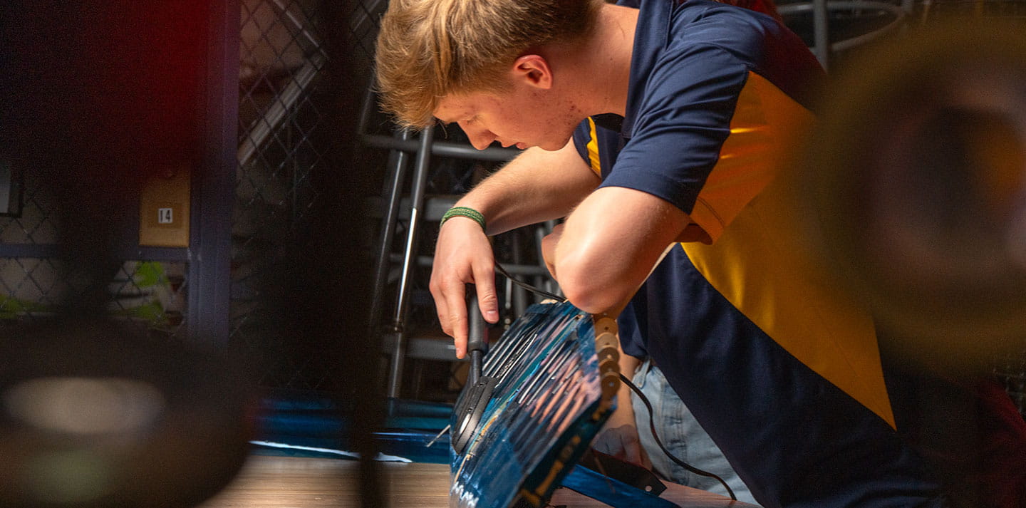 Student working in the Design-Build-Fly engineering lab
