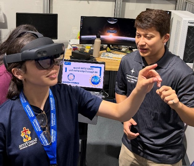 One Embry-Riddle student wears a VR headset while another Embry-Riddle student watches