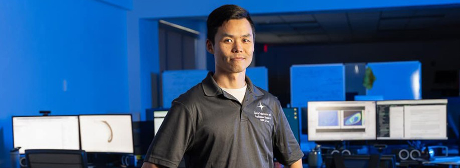 Embry-Riddle student stands for a picture in the lab