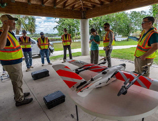 Dr. Dan Macchiarella prebriefs a team of students and faculty before a UAV mission