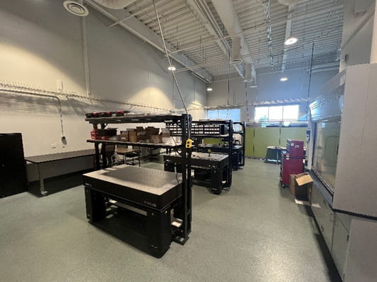 Interior view of the HAMMER Lab showing a clean research workspace with, equipment racks, workbenches and diagnostic instrumentation.