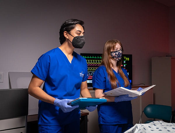 A male and female student engage in a lesson at the Embry-Riddle REACH Lab.