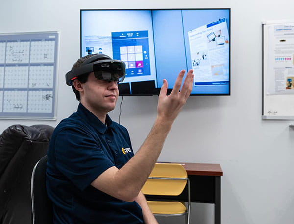 A student experiments with a hi-tech headset.