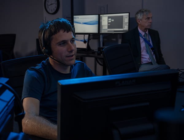 A professor and student in the TRACON Lab
