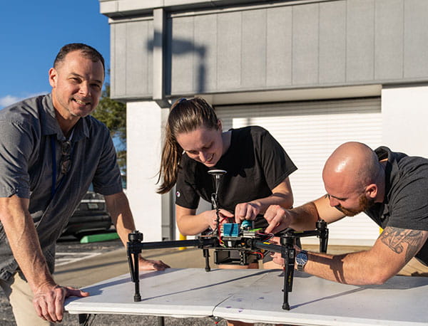 UAS students building a drone.