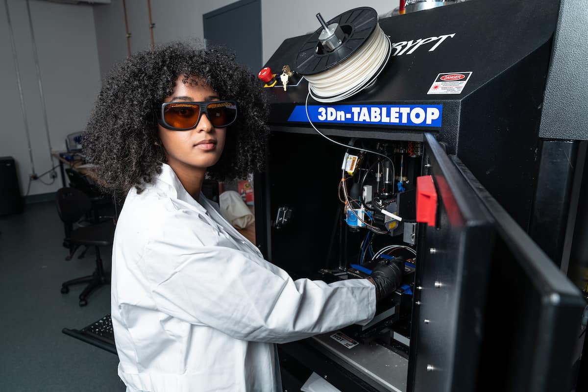 Sofia Mvokany working with a 3Dn-Tabletop manufacturing platform running nScrypt to create custom manufactured parts for research projects
