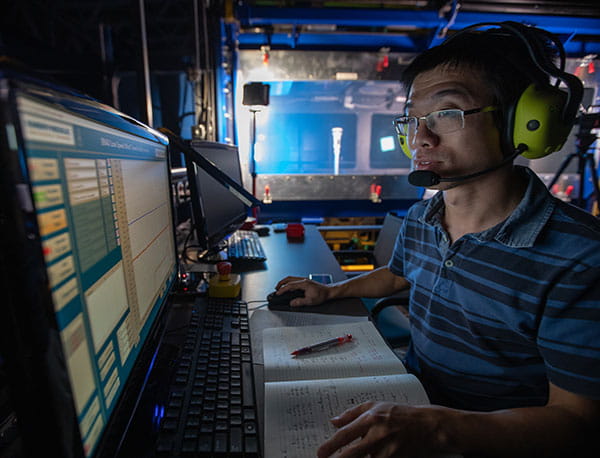 Dr. Zheng Zhang in the Wind Tunnel Facility