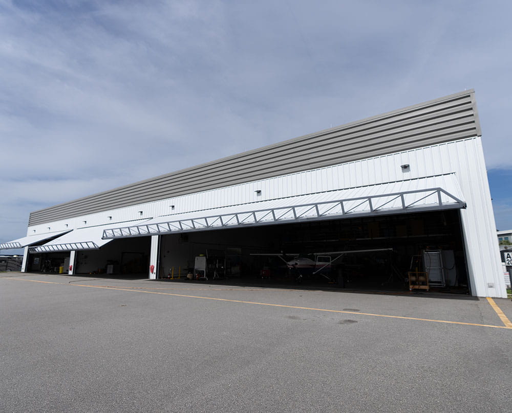 Applied Aviation and Engineering Research Hangar exterior with the hanger doors open