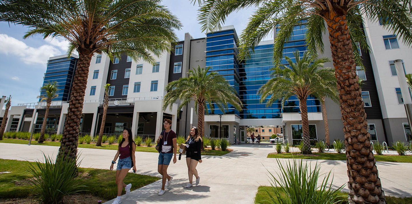 Students walking in front of residence hall