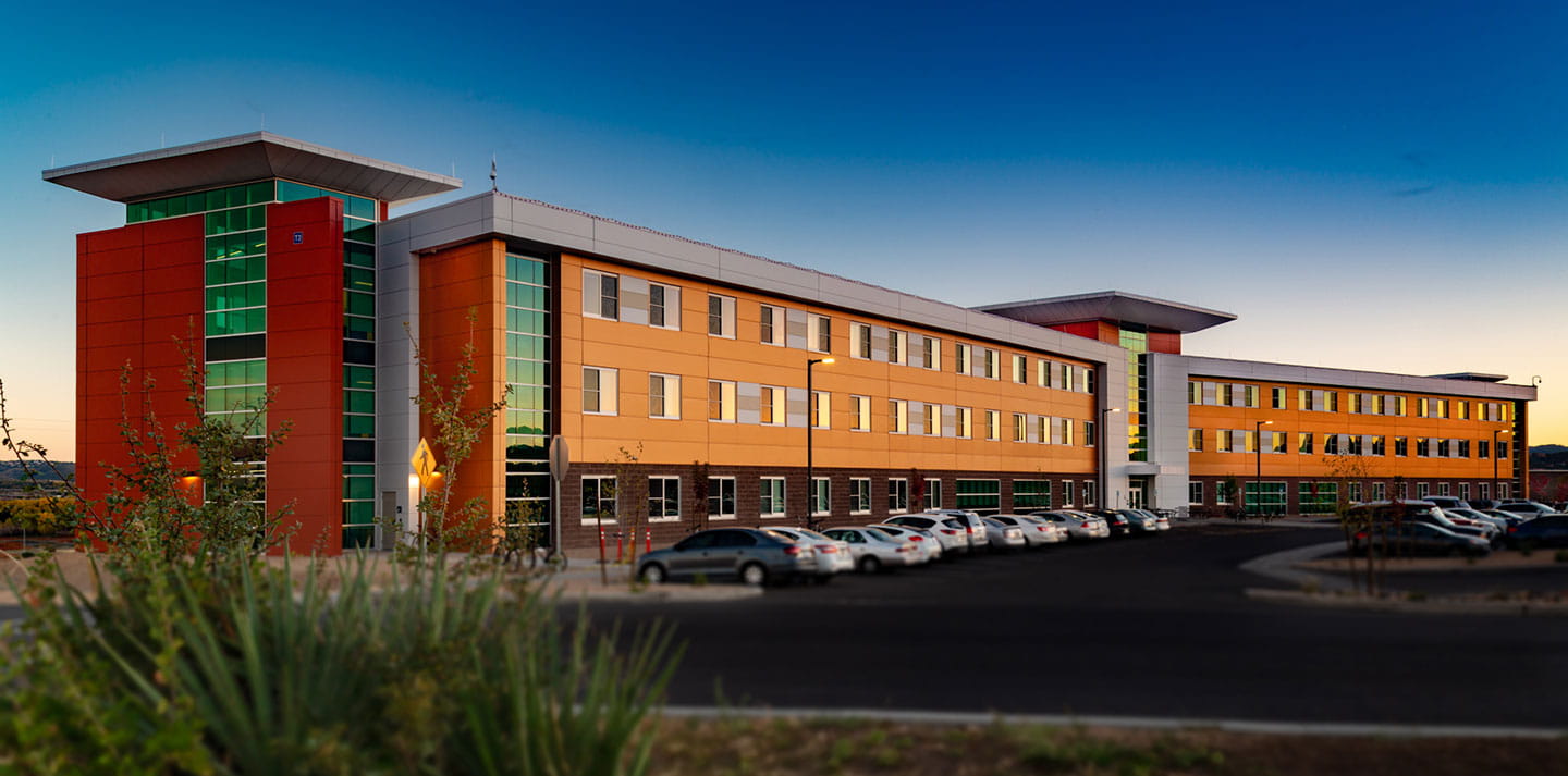 Exterior of Thumb Butte Complex Suites at sunset