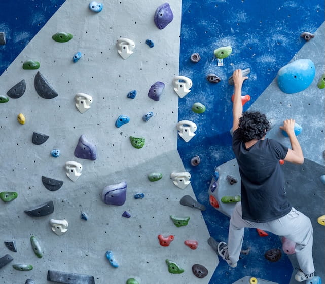 Embry-Riddle student climbs an indoor climbing wall