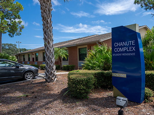 Exterior of Chanute Complex with palm trees