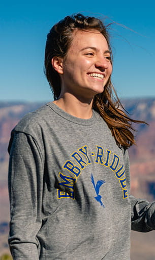 A student in an Embry-Riddle sweatshirt