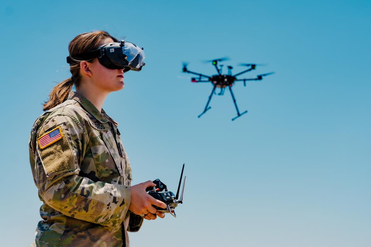 A female military student controlling a drone