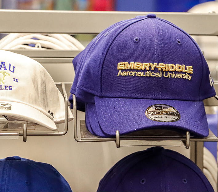 Hats sit on a display rack in the Embry-Riddle bookstore.