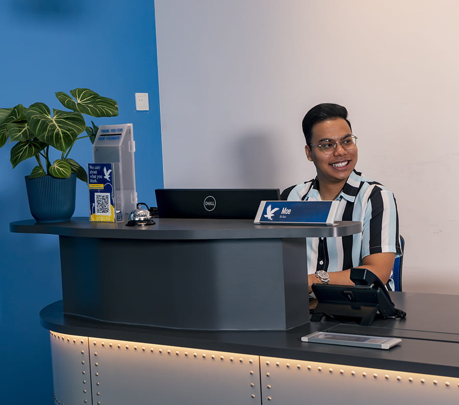 Embry-Riddle employee sits at a help desk