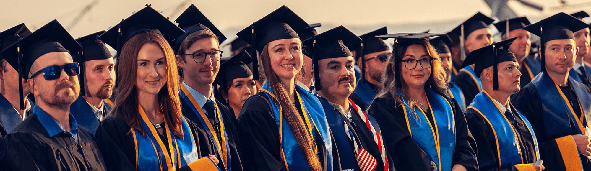 Students in caps and gowns at graduation