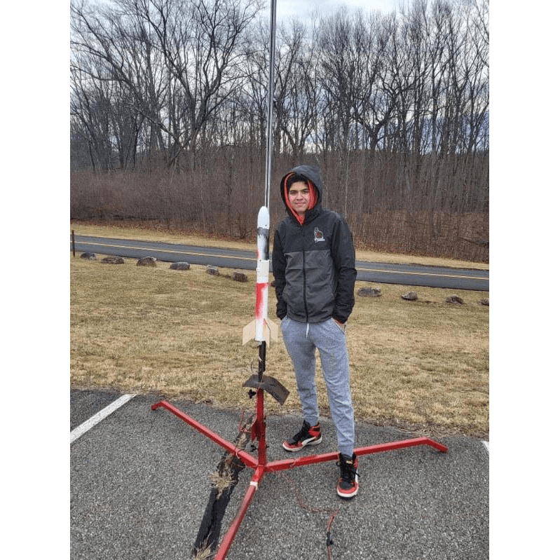 Adam Jain standing next to a launch-ready model rocket near his high school in Morristown, New Jersey. (Photo: Adam Jain)