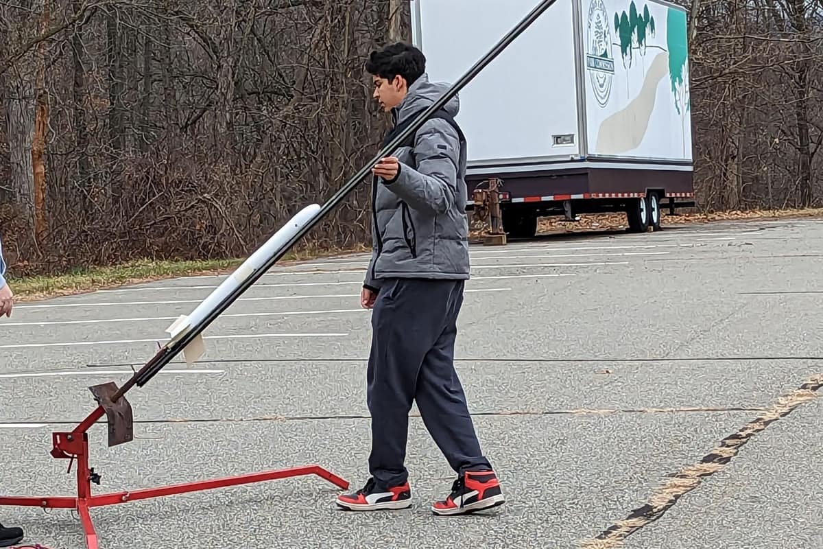 Adam Jain braves the New Jersey cold as he and his team get ready for their next model rocket launch.