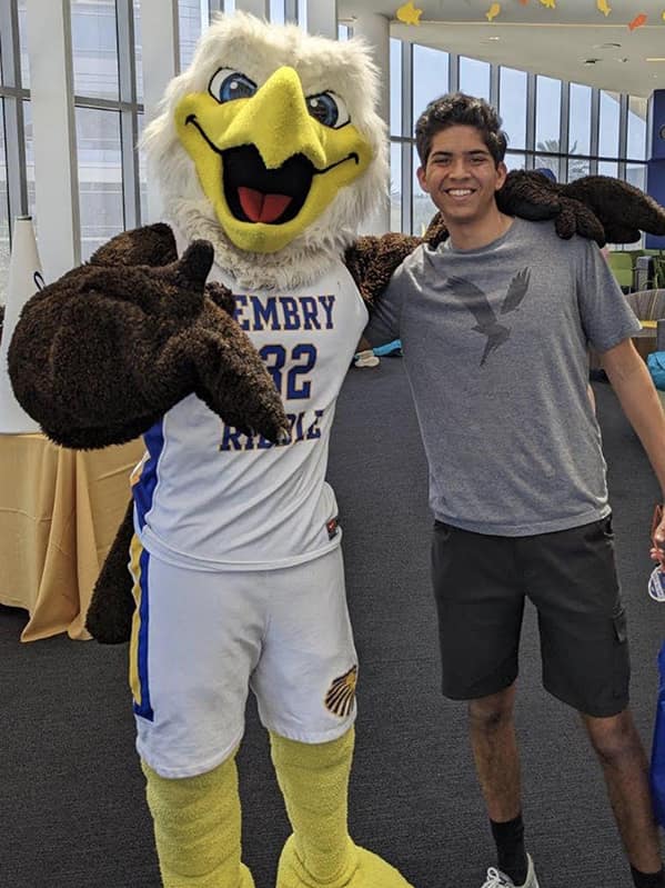Aerospace Engineering major Adam Jain hangs out with his new friend Ernie the Eagle on the Daytona Beach Campus.