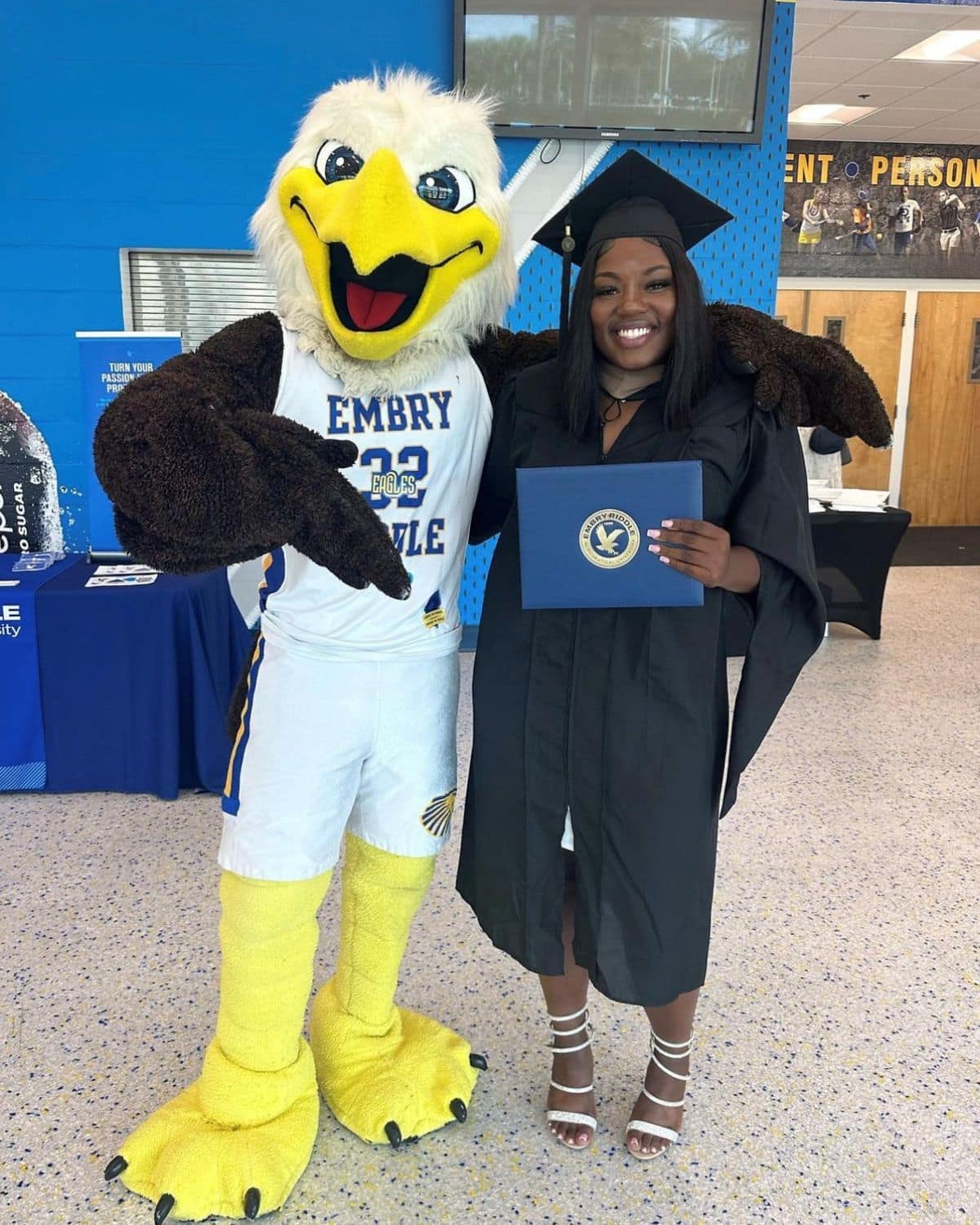 Ta'Leah Adams posing with ERNIE the eagle just after graduation. (Photo: Ta'Leah Adams)